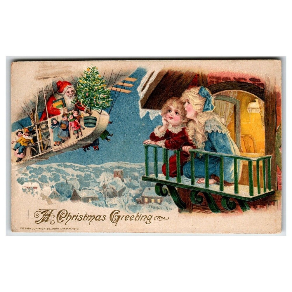 1913 John Winsch Christmas Postcard Santa in Airship with Toys Embossed Aircraft